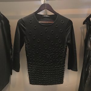 Fantastic sweater with sewn on brass rings